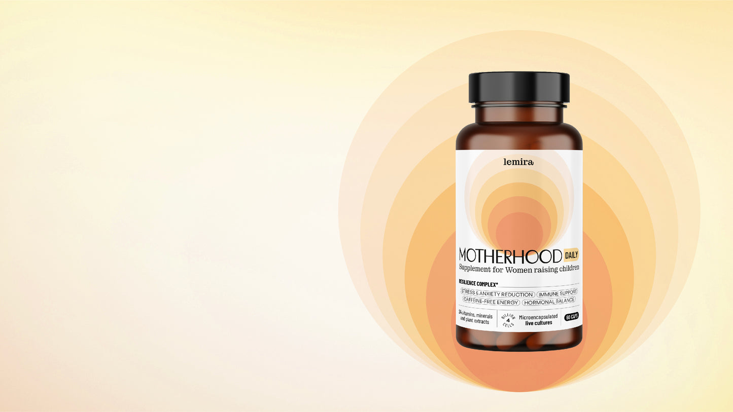Supplement bottle labeled 'Motherhood Daily' by Lemira on a sunrise like background