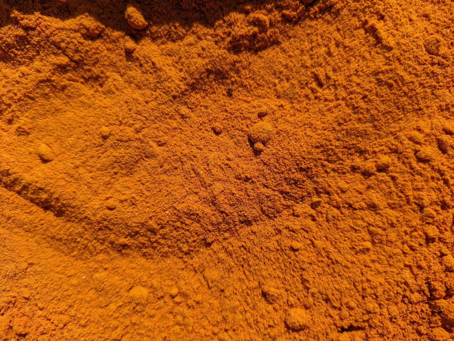 Close-up of orange powder with a textured surface